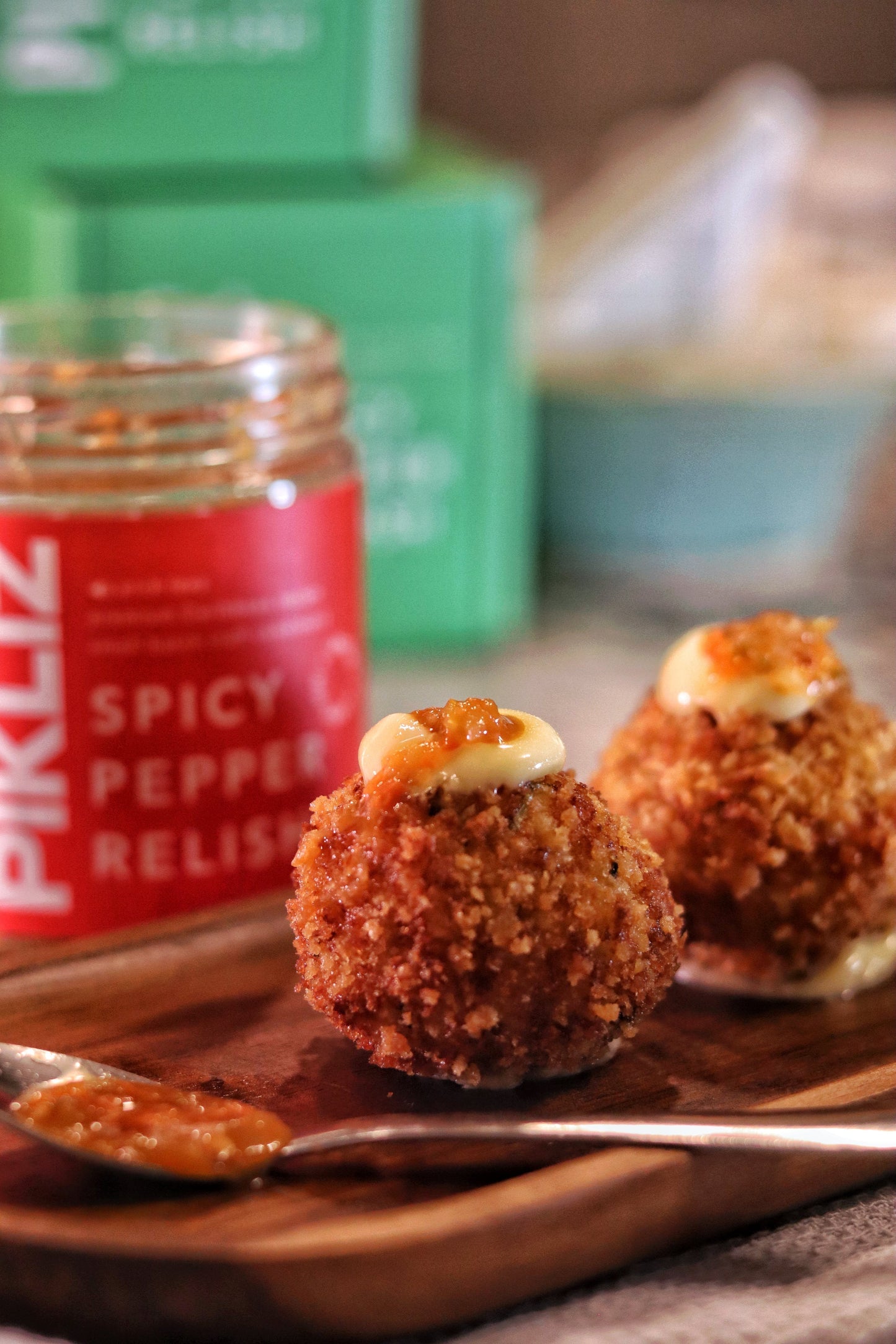 Cod croquettes served on a plate with Alexandra’s Pikliz®, showing how the spicy relish enhances crispy seafood dishes